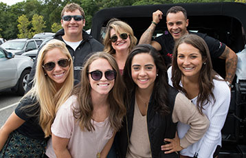 Members of the Bryant community smile during Reunion@Homecoming weekend.