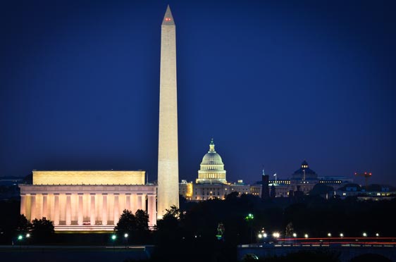 View of Washington DC at night featuring the Lincoln Memorial, and Washington monument with Capitol building in the background