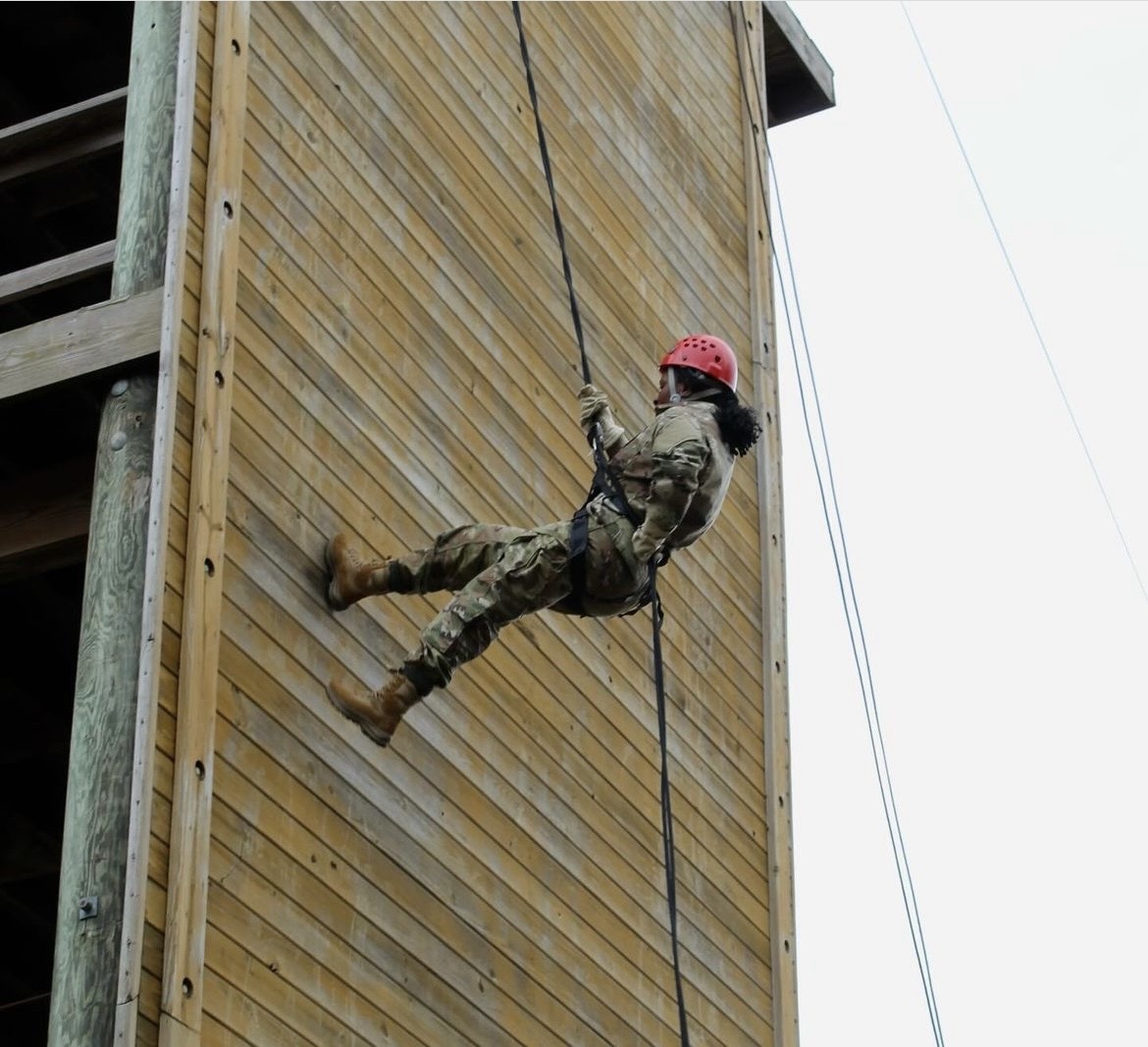 A cadet repels off of a tower during joint field training exercises.