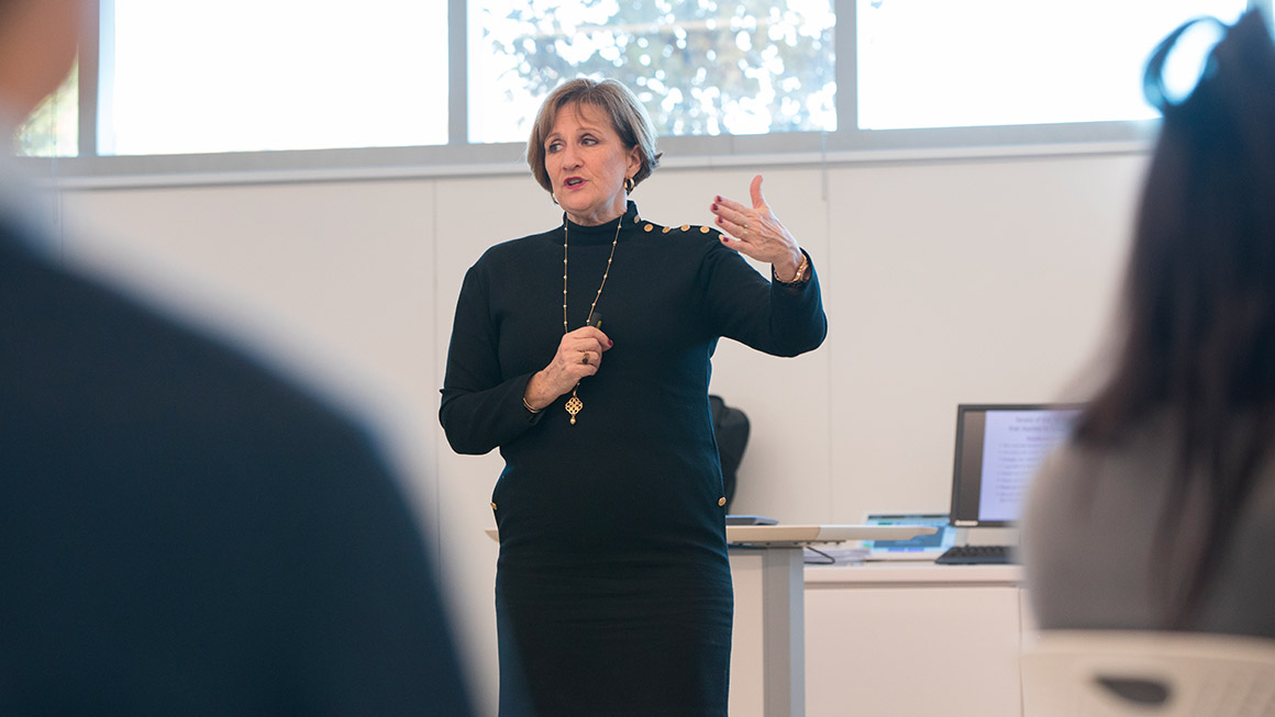 Bryant University Professor Lori Coakley teaches during an MBA class.