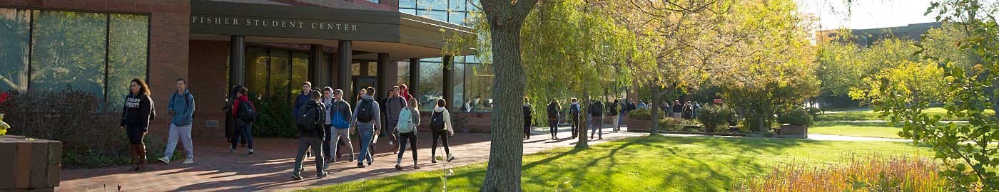 Students walk outside the Fisher Student Center at Bryant University