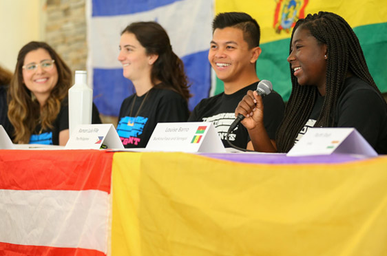 A group of Bryant University international students at a panel.