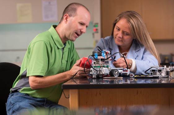Bryant Professor Brian Blais works with a student.