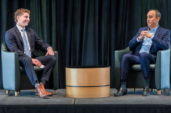 Robert Schunder '24 (left) led a fireside chat with Joe Fazzino '02, VP and Deputy CIO of Raytheon Technologies at Bryant University's 17th Annual Financial Services Forum.