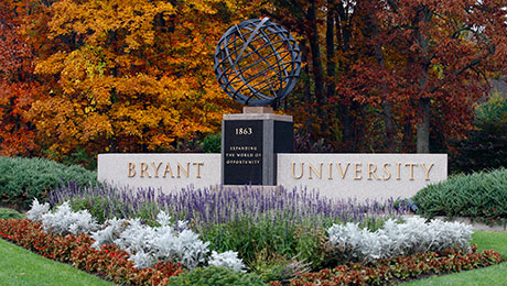 The entrance to Bryant University in the fall.