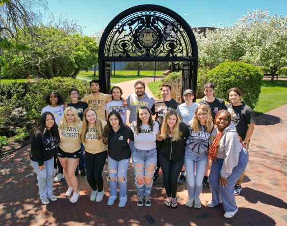 Kevin Niranjan poses with other orientation leaders under the Bryant archway.