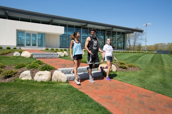 Students walk in front of the Bulldog Strength and Conditioning Center