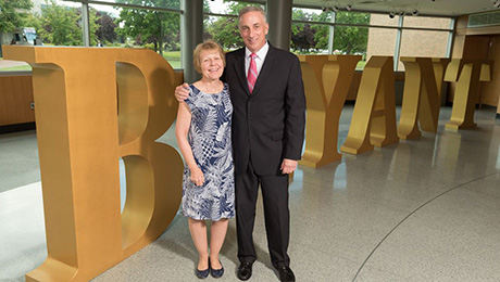  Marion (Sheahan) '81 and Frank '81 Hauck in front of the Bryant letters.