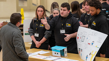A group of Bryant University students pitch their solution during IDEA.