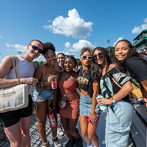 A group of Bryant students poses for a photo at Reunion@Homecoming.