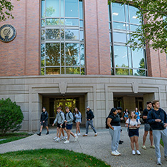 Bryant University students walk outside of the Business Entrepreneurship Leadership Center.